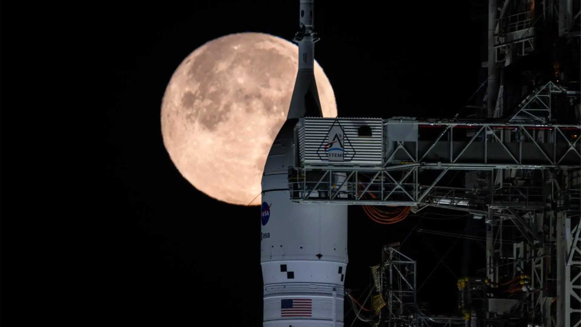 Orion spacecraft with a full Moon in the background.