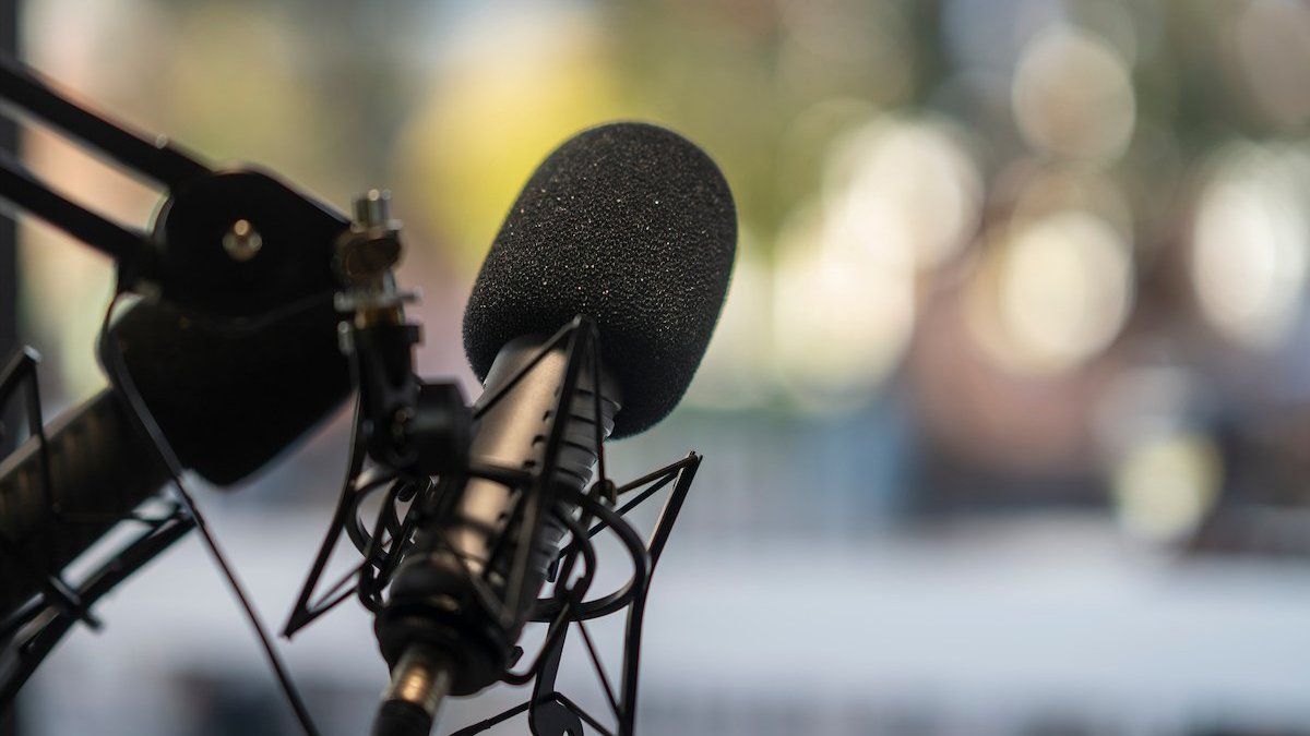 Close up shot of a radio microphone representing communicating in a media landscape.