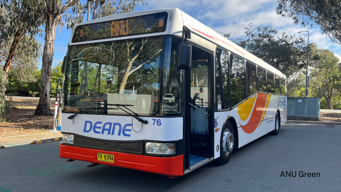 A parked DEANE bus displaying &ldquo;ANU&rdquo; on its LED route sign, indicating it services the university.