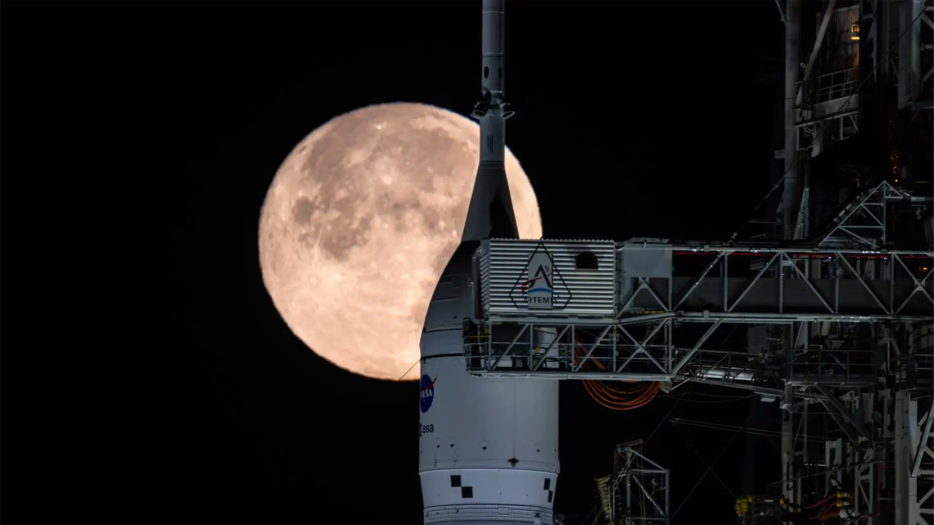 Orion spacecraft with a full Moon in the background.