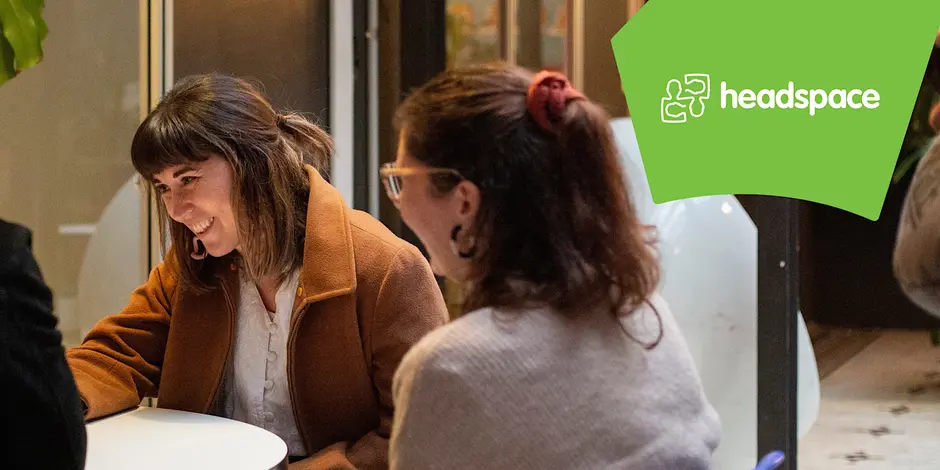  Two women sitting together and chatting with a 'headspace' banner at the top. 