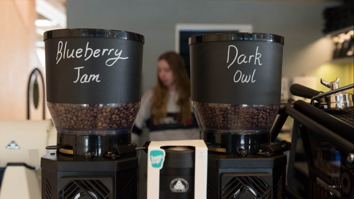 Two coffee grinders labelled &lsquo;Blueberry Jam&rsquo; and &lsquo;Dark Owl&rsquo; filled with beans at Craft Beans in Kambri.