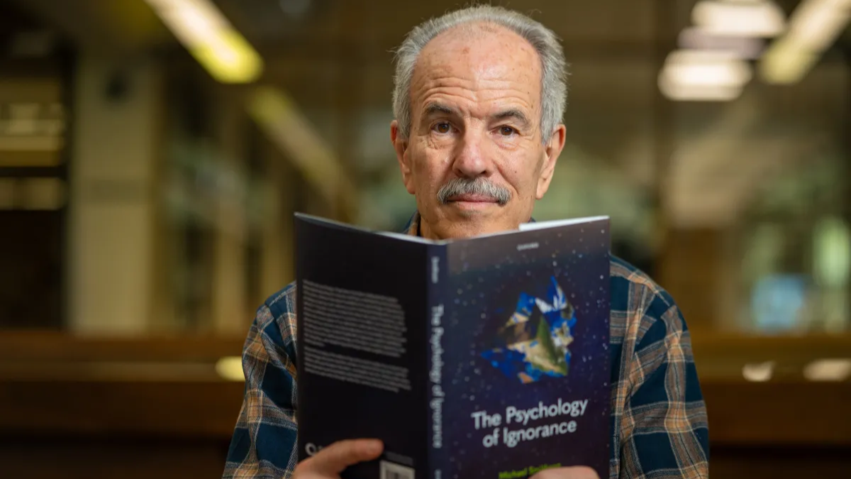 Emeritus Professor Michael Smithson is reading a book titled The Psychology of Ignorance.  