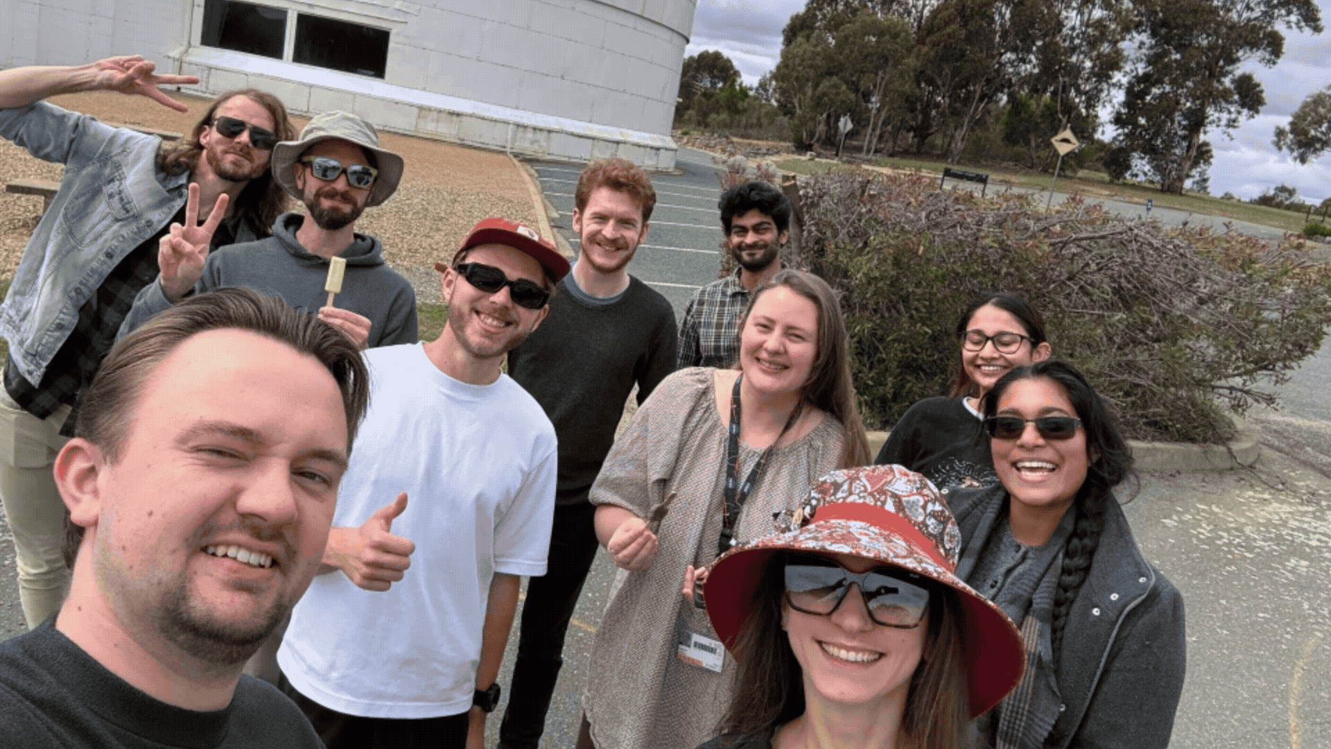 Gif of two images - a selfie from the the Research School of Astronomy and Astrophysics team, and a photo of an Echidna that they spotted on their walk. 