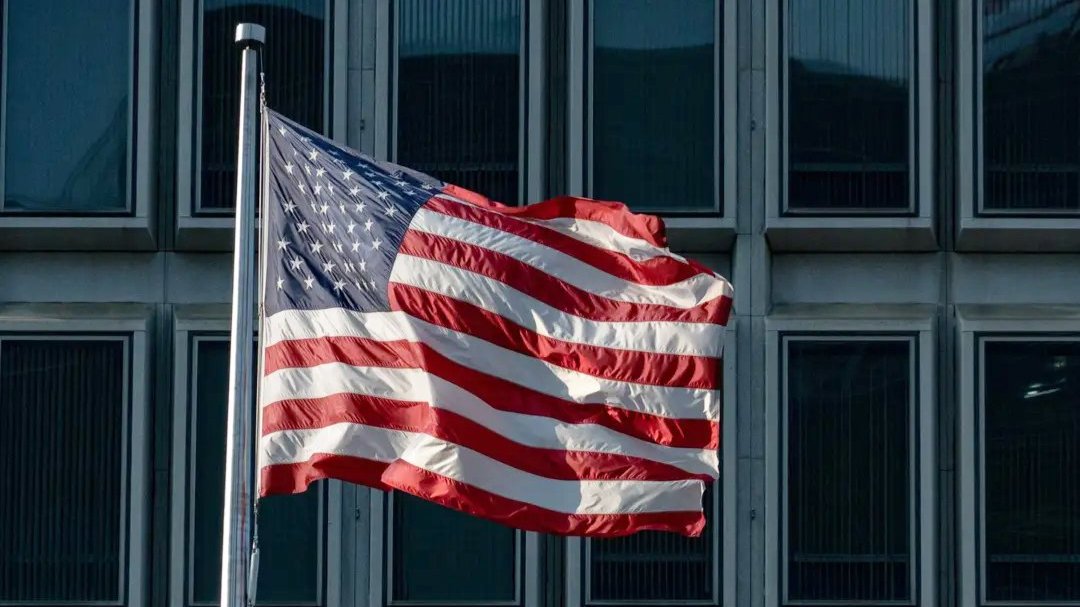 Image of the American Flag blowing in the wind.