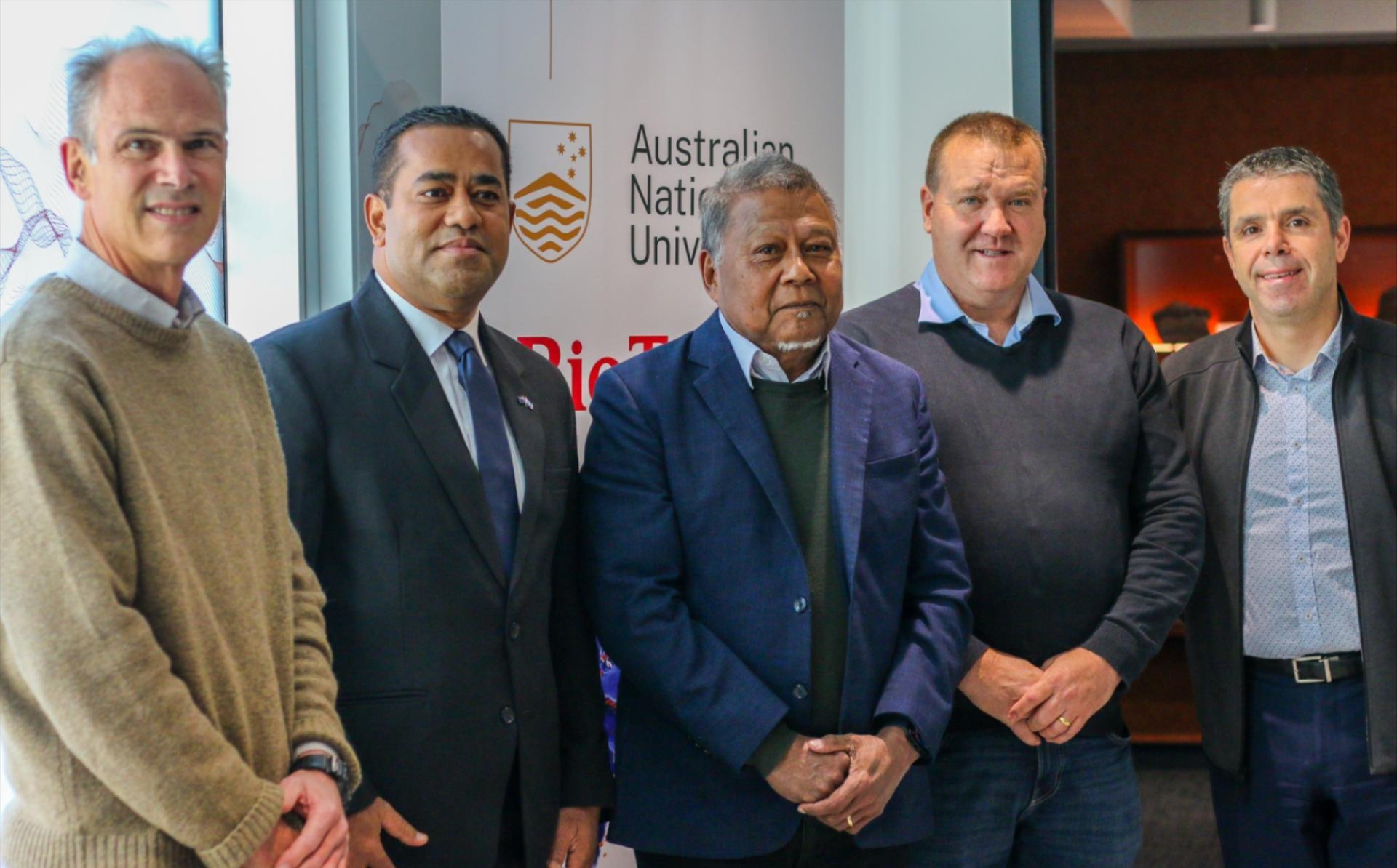Five men standing together at an Australian National University event.