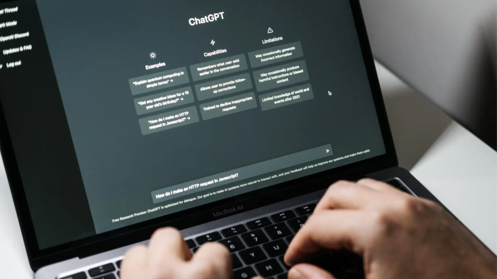 Person using ChatGPT on a laptop.