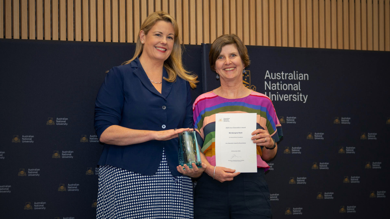 Georgina Nash receives the VC Award from Interim Vice-Chancellor Professor Rebekah Brown.