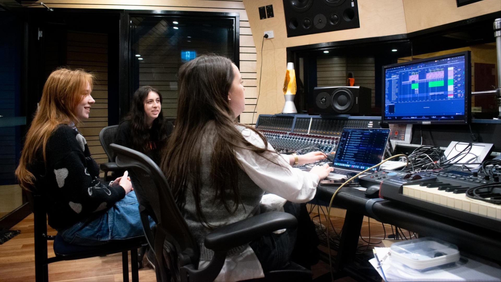L-R: Lillian Fromyhr, Molly Jae and Sophie Edwards in the recording studio control room.